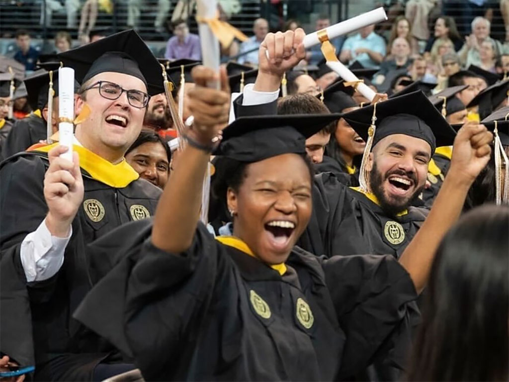 graduates at commencement