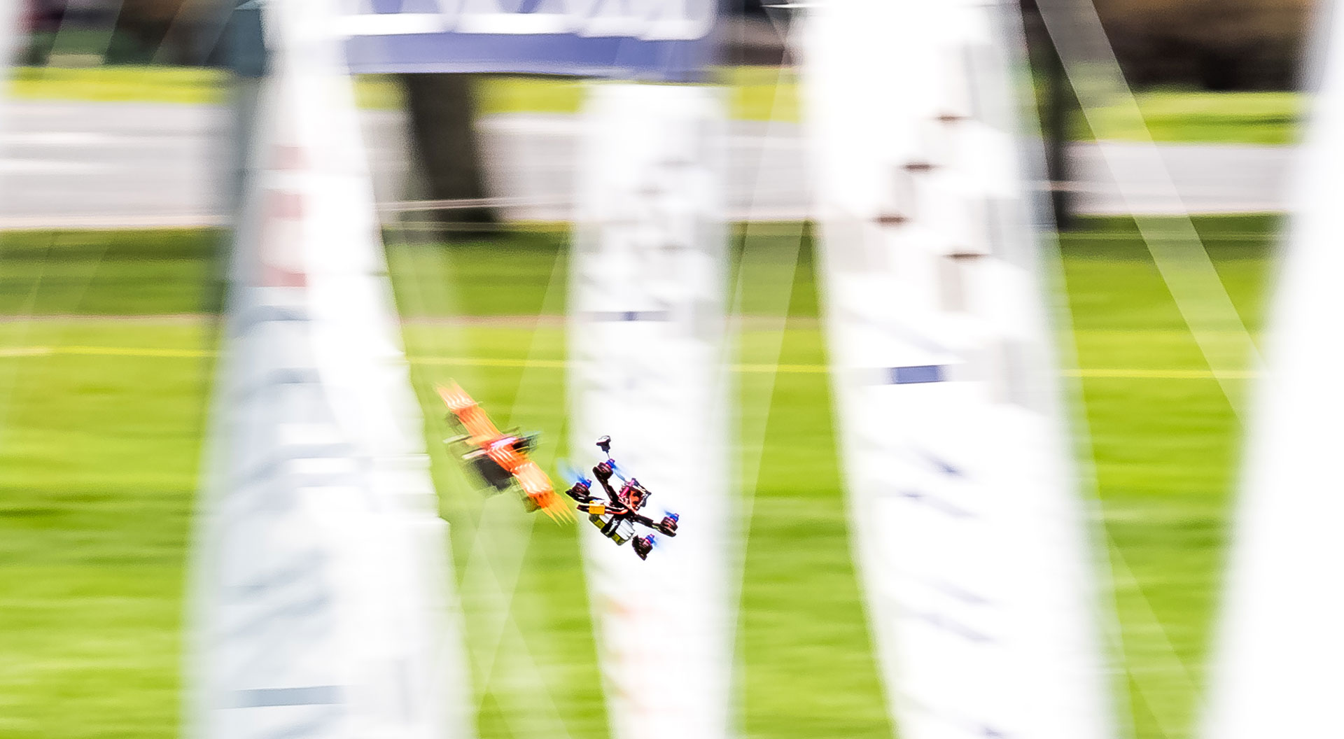 Two drones moving at high speed through a racecourse