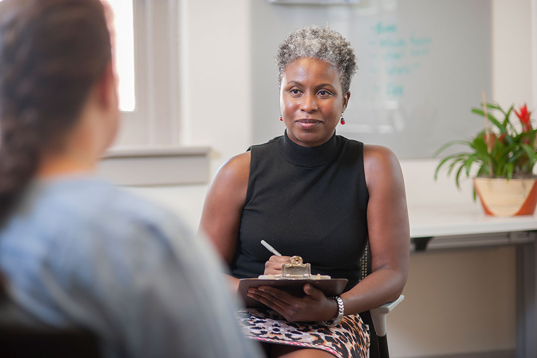 A counselor listening to a student