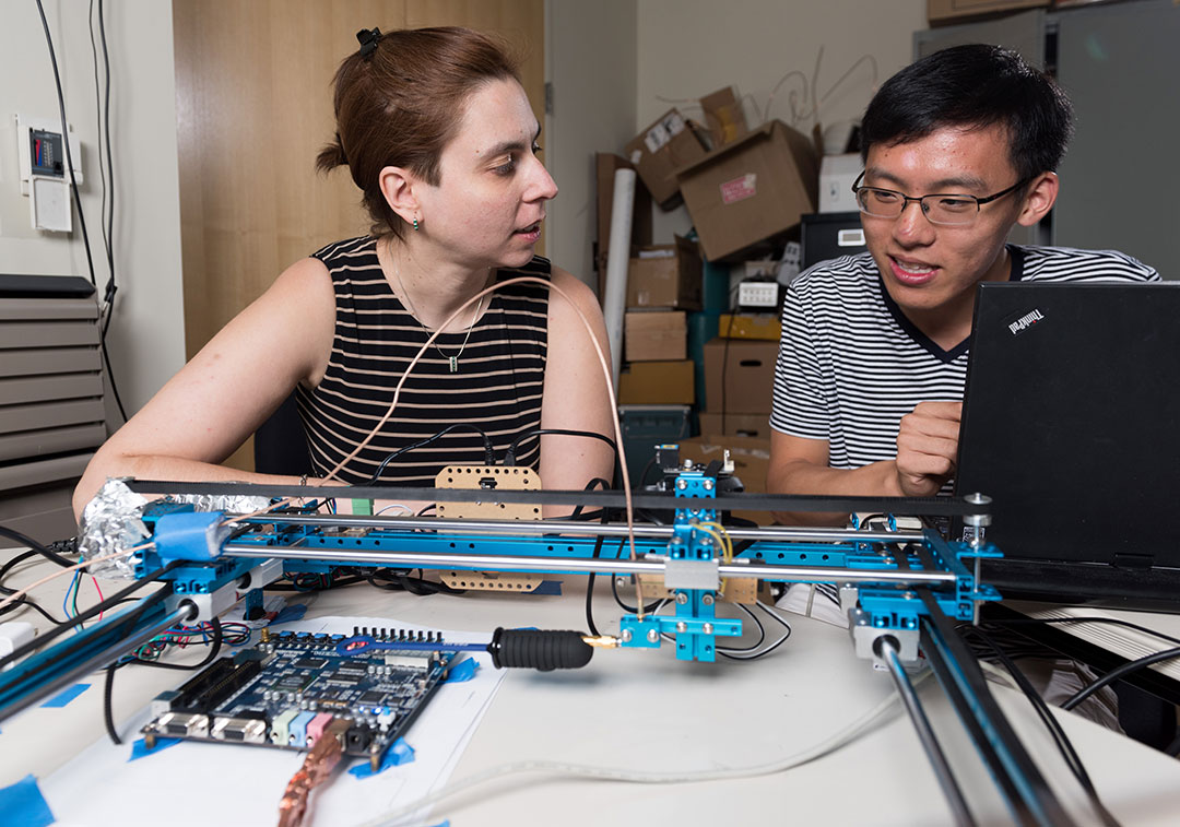 Zajic in her lab with another researcher