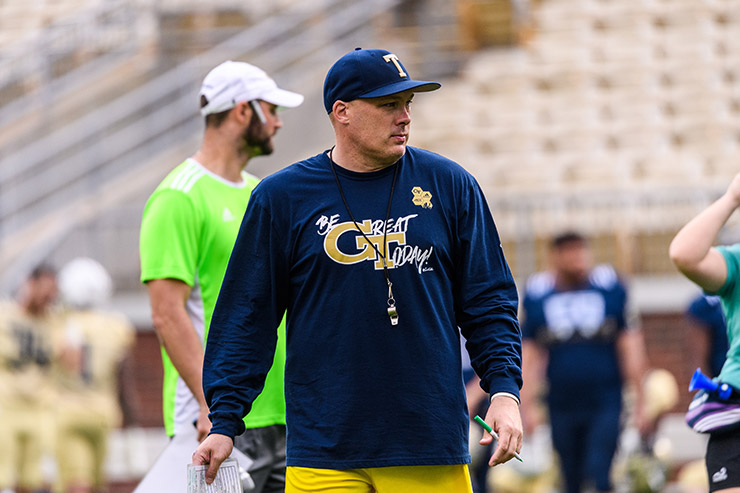 Coach Geoff Collins on the field.