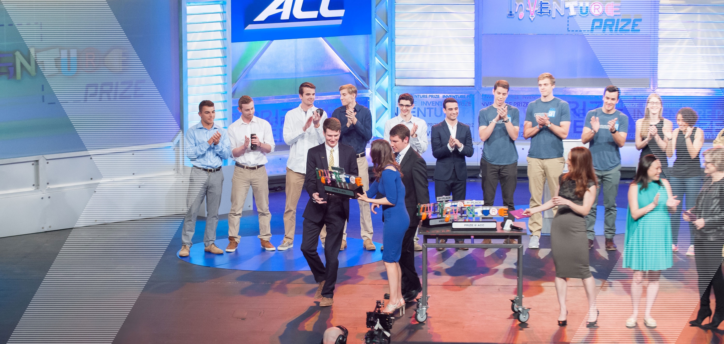 The FireHUD team is presented with the People's Choice Award onstage at the ACC Inventure Prize competition