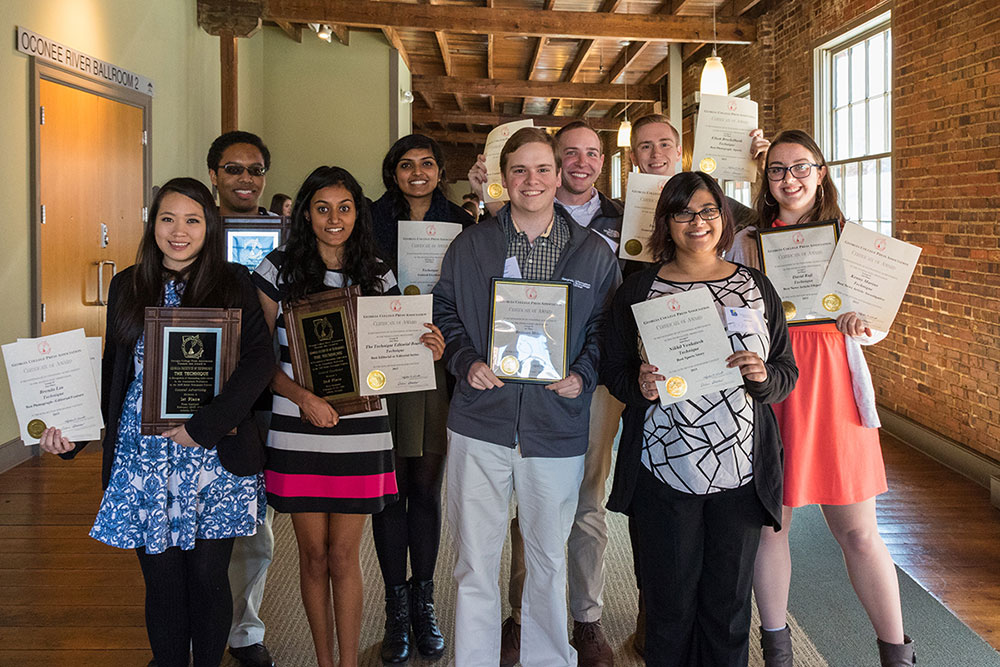 Group photo of the Technique staff with their award plaques and certificates